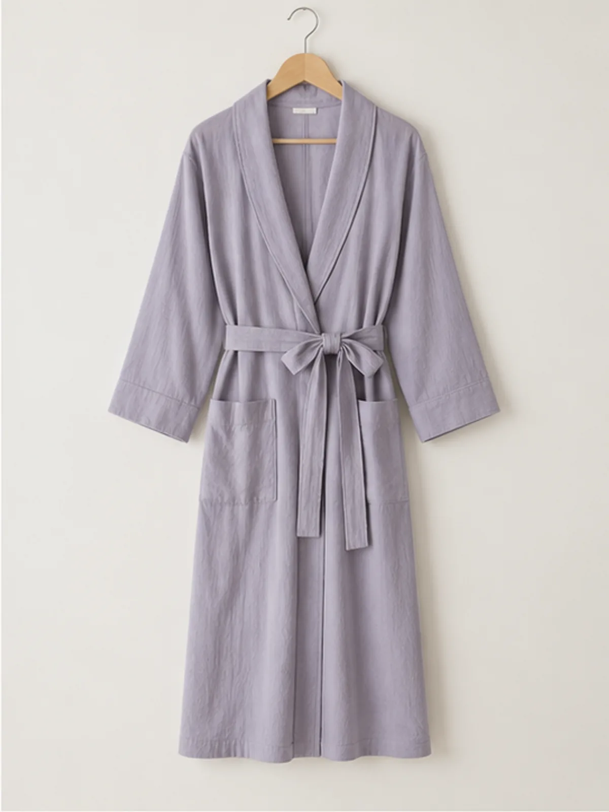 meadow cotton robe 2.webp meadow cotton robe hanging on a wooden hanger
